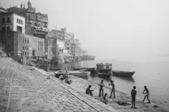 Black-and-white photo of people at a harbour in India