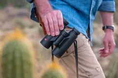 Man holding a Leica Trinovid HD