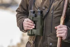 Hunter with his Leica Geovid Pro in olive green