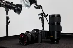 Leica SL3-P with Vario-Elmarit-SL 24-70 on a table next to the Vario-Elmarit-SL 70-200