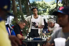 Documentary photograph of photographer Billy Dinh observing a chess game in a New York City park with a Leica Q, capturing everyday street photography and urban life.
