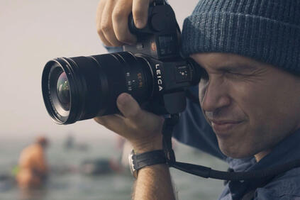 Close-up of a man taking a picture.