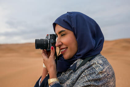 Woman with a Leica M11-Monochrom in the desert