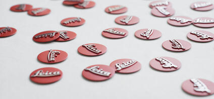 Buttons labeled Leica are distributed on a white background.