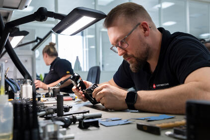 Man repairs a Leica Camera