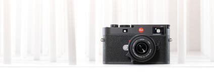 Leica Camera in front of a white background.