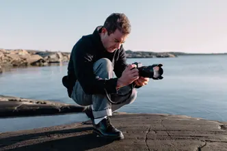 A person is taking photographs with the Leica SL3-S.