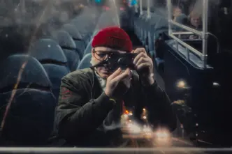 Man in a Bus with leica camera