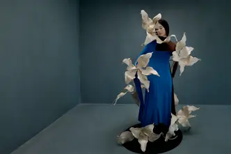 Woman in a blue dress with big flowers