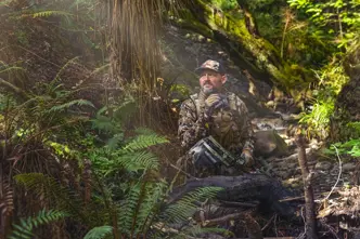 Hunter sitting in a forrest