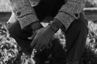 Brandon Ruffin sitting on a bank with his Leica ZM2