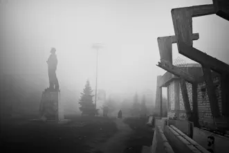 statue in the mist b&w