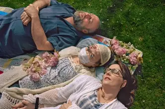 Katie with her family laying in grass