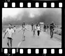 children running from napalm attack b&w 