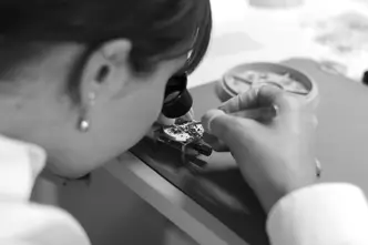 A woman assembling a Leica watch
