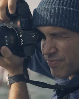 Close-up of a man taking a picture.