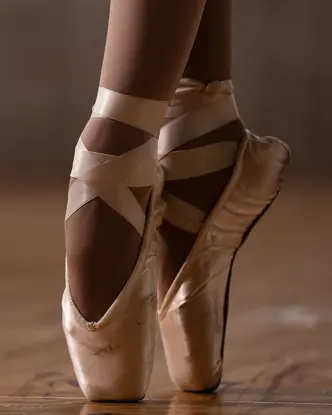 Close-up of a ballerina's feet in ballet shoes. 