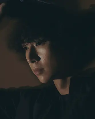 Close-up of a person laying on the floor.