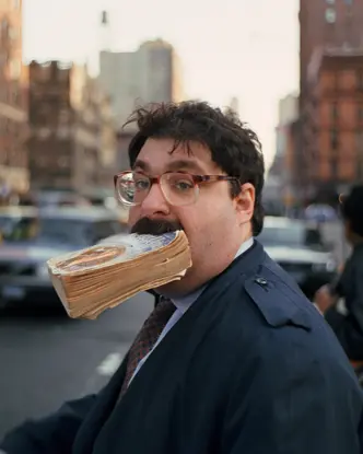 Man with a book in his mouth