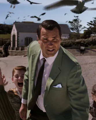 A man and five kids running away from crows 