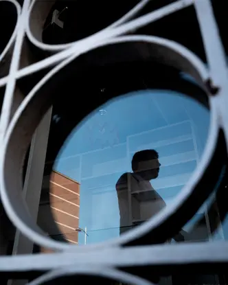 Reflection of a man in a building