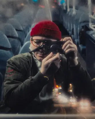 Man in a Bus with leica camera