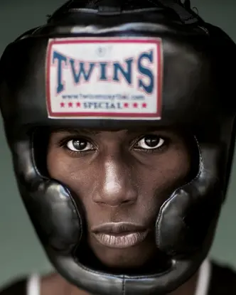 Portrait of a black boxer wearing a boxing helmet