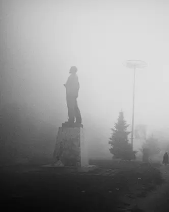 statue in the mist b&w