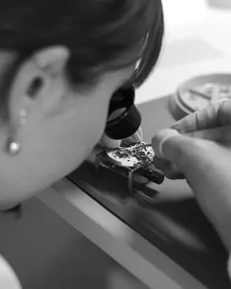 A woman assembling a Leica watch