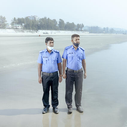 Two police officers on the beach