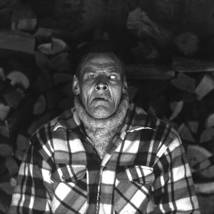 Man lying on the floor with his eyes rolled up.