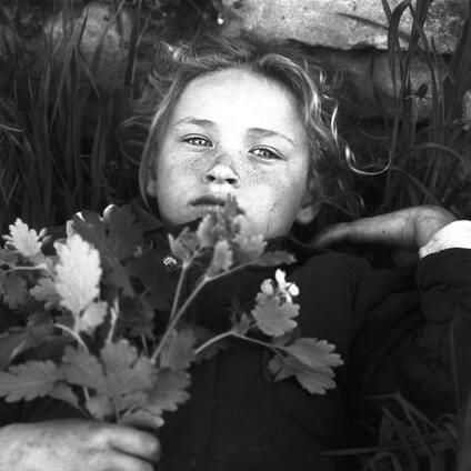 Girl with flowers in black and white.