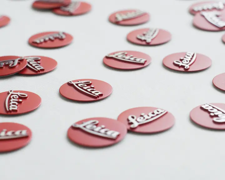 Buttons labeled Leica are distributed on a white background.
