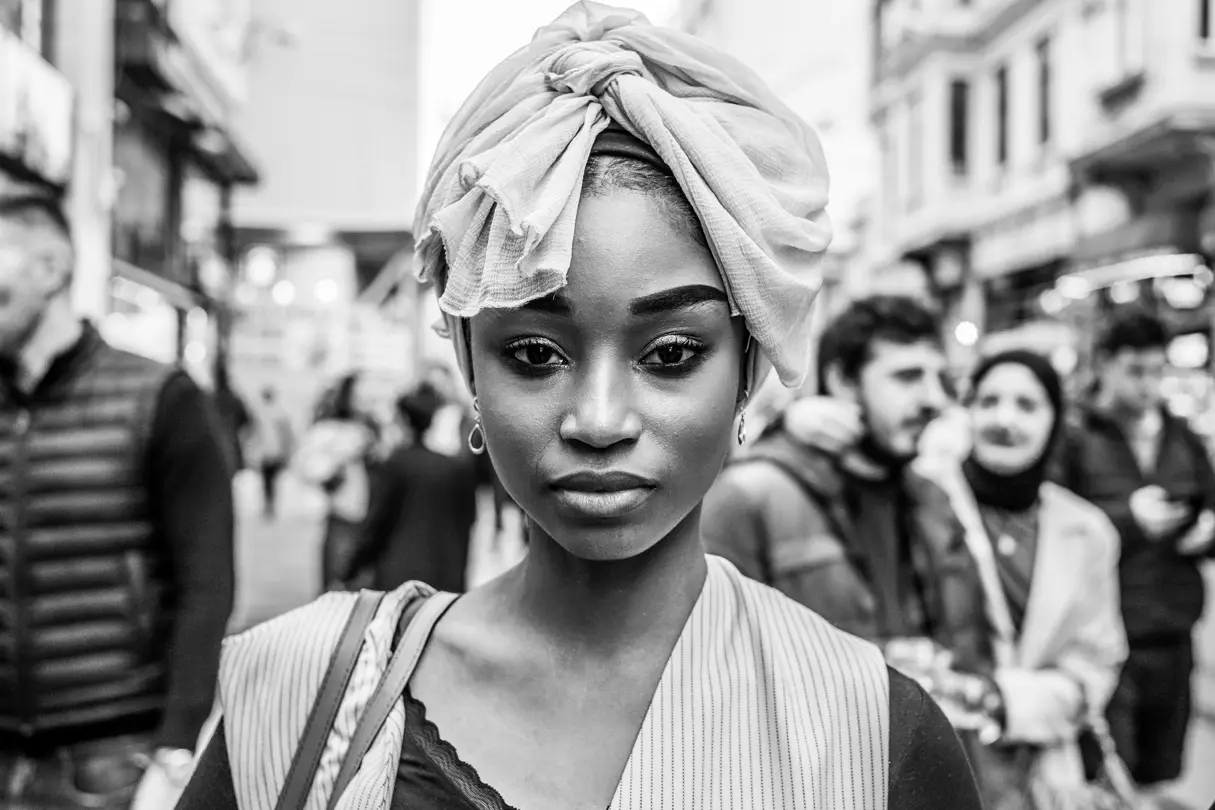 Woman standing in a crowd