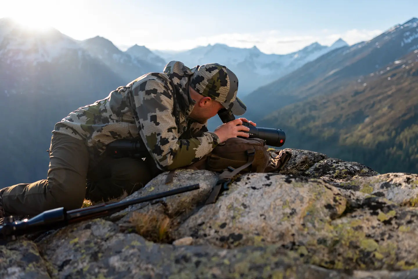 Man is looking through his Televid spotting scope