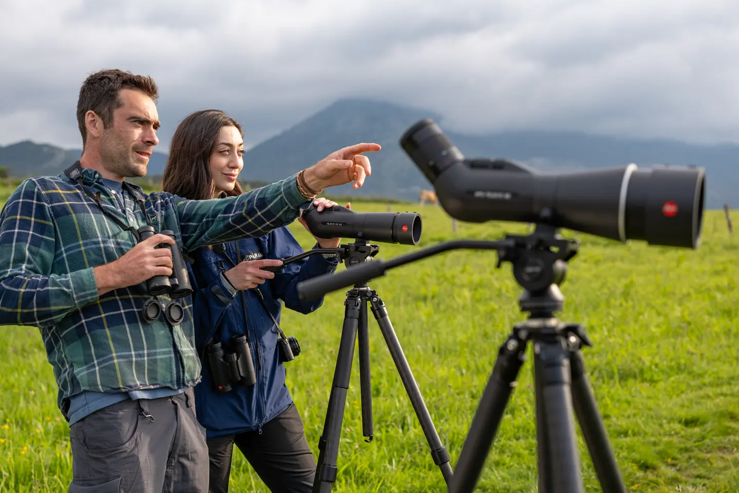 Man and woman showing their Leica spotting scopes
