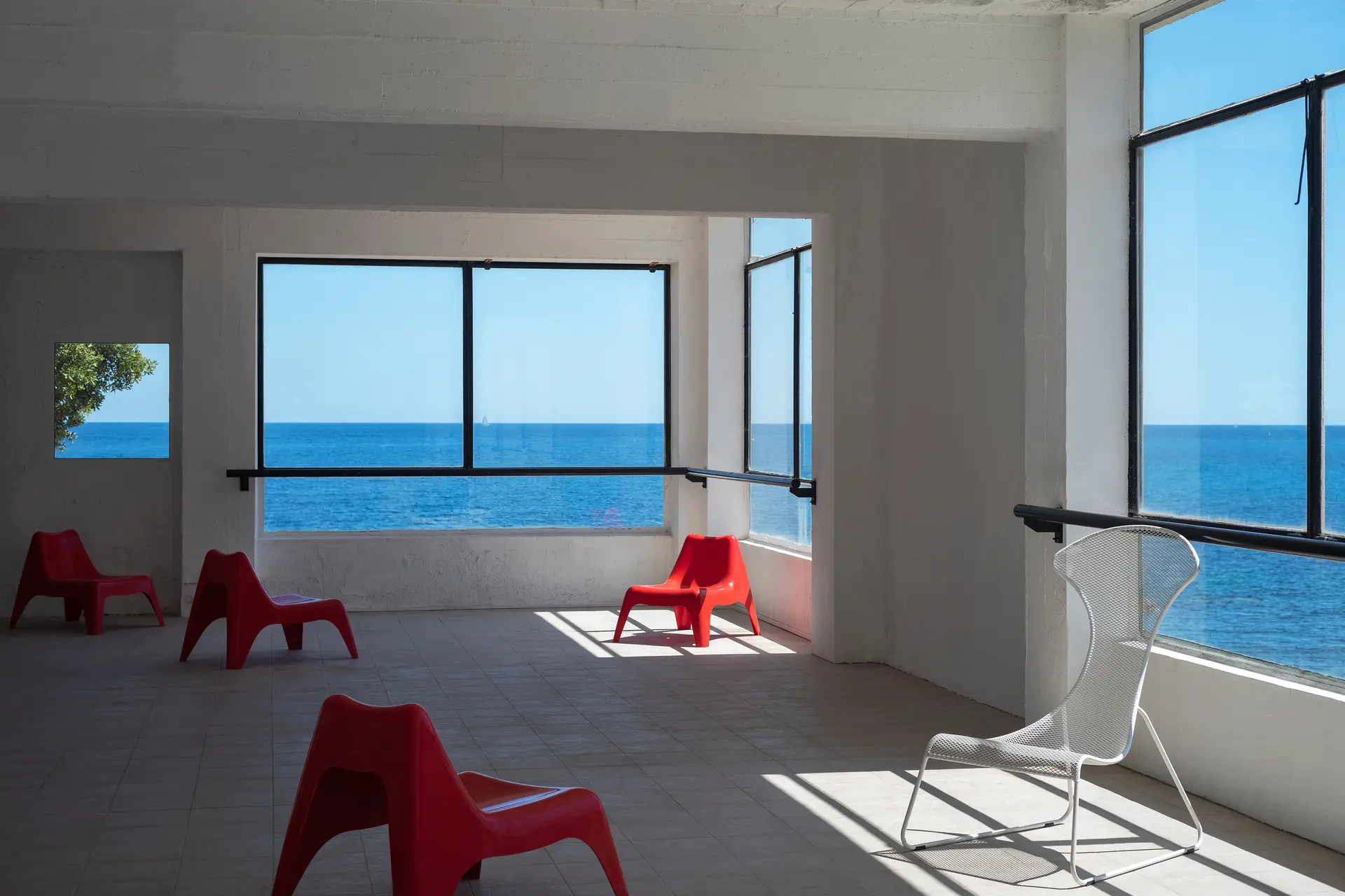 Red chairs in an empty room